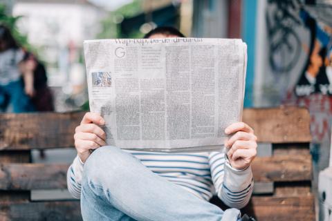 man reading newspaper